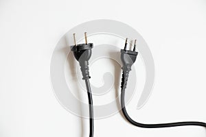 Two black cables with plugs on a white background, cable