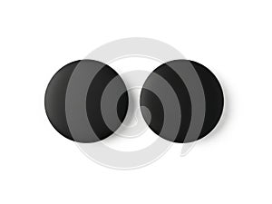 Two black circular objects on a white background isolated on white background