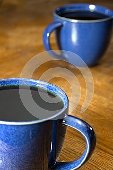 Two Black Coffees in Blue Mugs