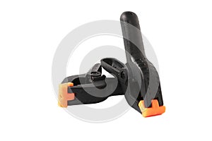 Two black construction clips clothespins