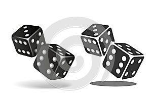 Two black falling dice isolated on white.