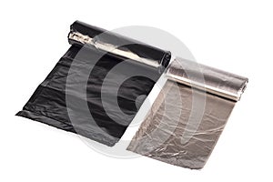 Two black garbage bags rolled into a roll. Close-up. Isolate