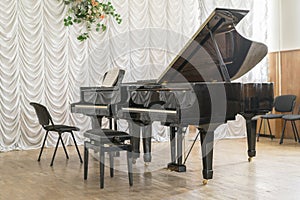Two black grand pianos on stage.