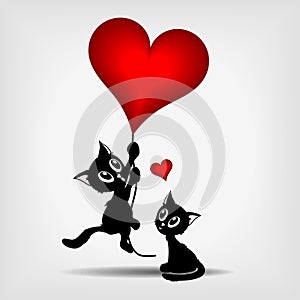 Two black kittens and red heart-balloon