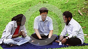 Two Black Man Listening to Their Team Leader Briefing While Sitting in the Nature