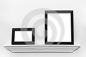 Two Black Picture Frames on a Picture Ledge Ready for your Image