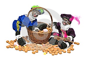 Two black piet with a basket full confetionery