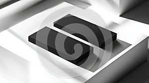 Two black rectangular boxes on a white surface with shadows