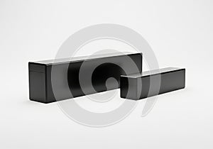 Two black rectangular objects with a smooth and shiny surface on a white background