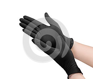 Two black surgical medical gloves isolated on white background with hands. Rubber glove manufacturing, human hand is wearing a lat