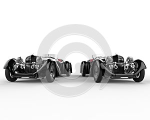 Two black vintage cars - front view