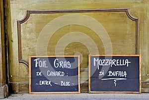 Two blackboards at a shop in France