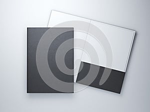 Two blank black folders