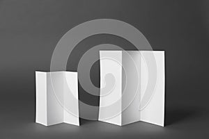 Two blank brochures on dark grey background