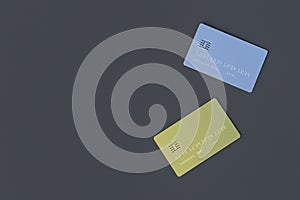 Two blank credit card gold and silver color on gray background