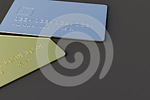 Two blank credit card gold and silver color on gray background