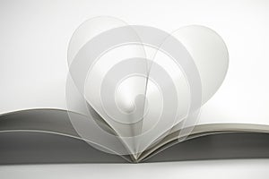 Two blank magazine pages that becomes one heart shape. Clean front view photo of magazine on white background, as concept for