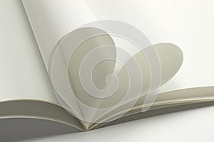 Two blank magazine pages that becomes one heart shape. Clean photo of magazine on white background, as concept for valentines day