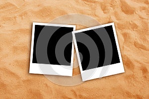 Two Blank photo frames on beach sand