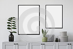 Two blank picture frames mockup on gray wall. Templates for painting or poster. White living room interior design.