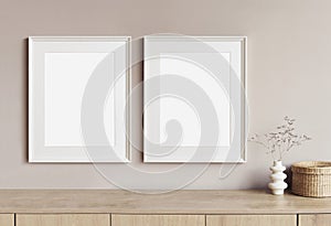 Two blank picture frames mockup on a wall. Templates for painting or poster. White living room interior design.