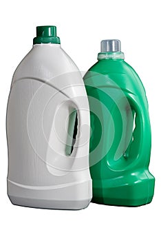 Two blank plastic white and green bottles of laundry detergent or cleaning agent isolated on white background. Mockup