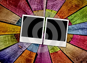 Two Blank Polaroids on Wooden Background