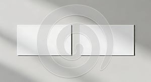 Blank Mockup of Two Rectangular Cards on a Light Gray Wall