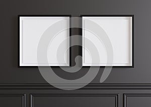 Two blank square picture frames hanging on black wall. Template, mock up for artwork, picture or poster. Empty, copy