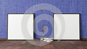 Two blank square posters. frame mock up standing on dark parquet floor next to blue wall with vase and books.