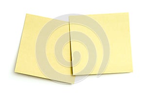 Two blank sticky notes on white