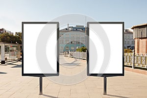 Two blank vertical street billboards