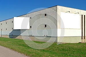 Two blank white advertising billboards mock-up on the wall of old industrial building