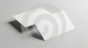 Two blank white rectangular cards floating on a light gray surface