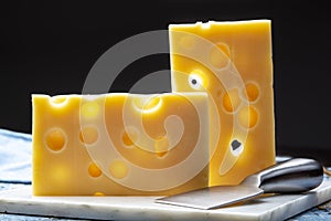 Two blocks of French emmental semi-hard cheese