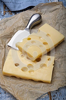 Two blocks of French emmental semi-hard cheese