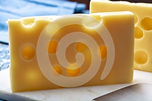 Two blocks of French emmental semi-hard cheese