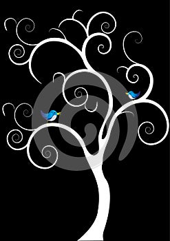 Two blue birds singing in a white tree