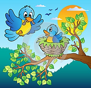 Two blue birds with tree branch photo
