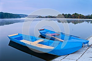 Two blue boats on lake