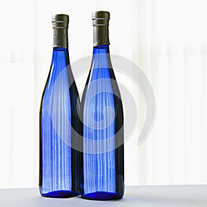 Two blue bottles.