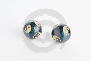 Two blue chinese yin yang balls on white background