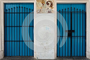 Two blue doors with security gates on the streets of Havana, Cuba