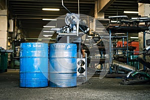 Two blue industrial barrels