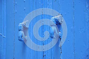 Two blue knockers hand design, Tunisian blue door photo