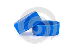 Two blue plastic bottle caps