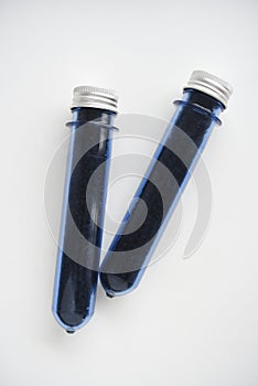 Two blue plastic flasks with a shiny lid. Flasks with tea inside