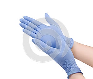 Two blue surgical medical gloves isolated on white background with hands. Rubber glove manufacturing, human hand is wearing