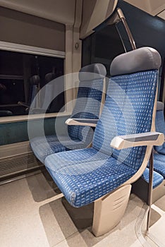 Two blue train seats