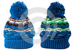 Two blue warm wool winter knit ski hat isolated white